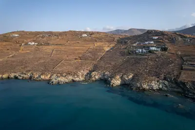 Houses and agricultural terraces near the coastline, Agios Sostis, Tinos, Greece